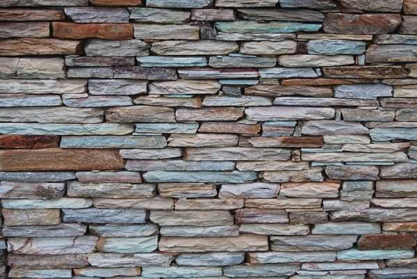 Autumn Emerald Mix Quartzite Drypack Cladding — split-face quartzite, installed on a wall