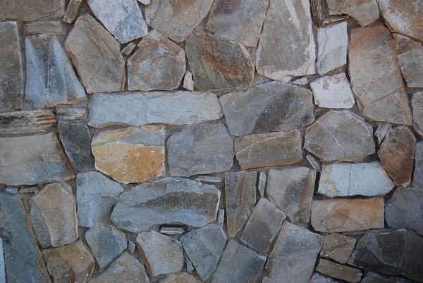 Beige Quartzite Vertical Drypack Cladding — split-face quartzite, installed on a wall