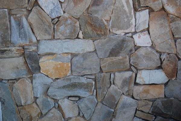 Beige Quartzite Vertical Drypack Cladding — split-face quartzite, installed on a wall