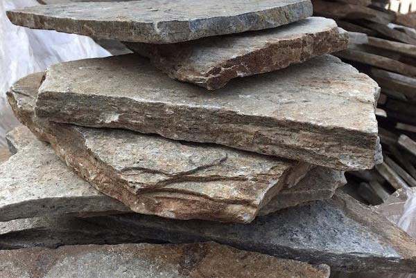 Beige Quartzite Vertical Drypack Cladding — split-face quartzite, installed on a wall