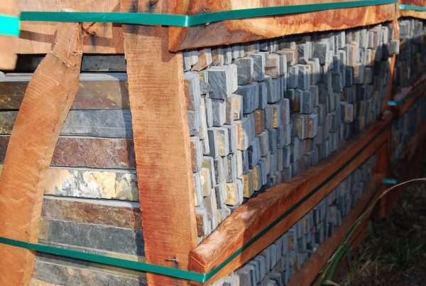 Multi colour slate riven pieces packed in a supply crate
