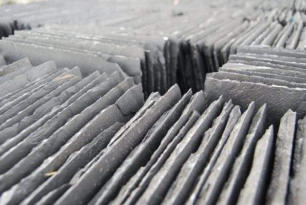 Slate roofing tiles stacked in a crate at the yard