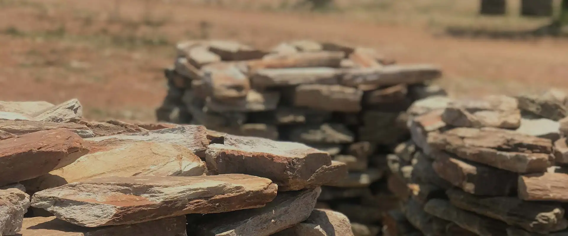 Close-up of split walling stone stacked in the quarry yard
