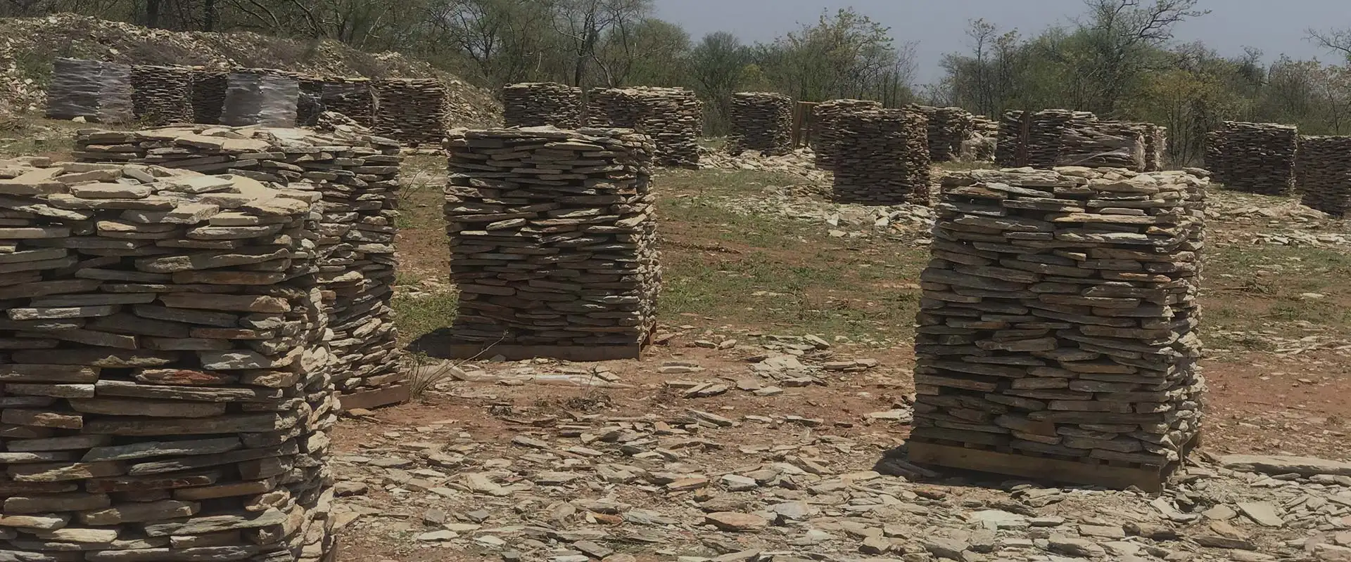 Pallets of split stone stacked in rows at the quarry, ready for dispatch