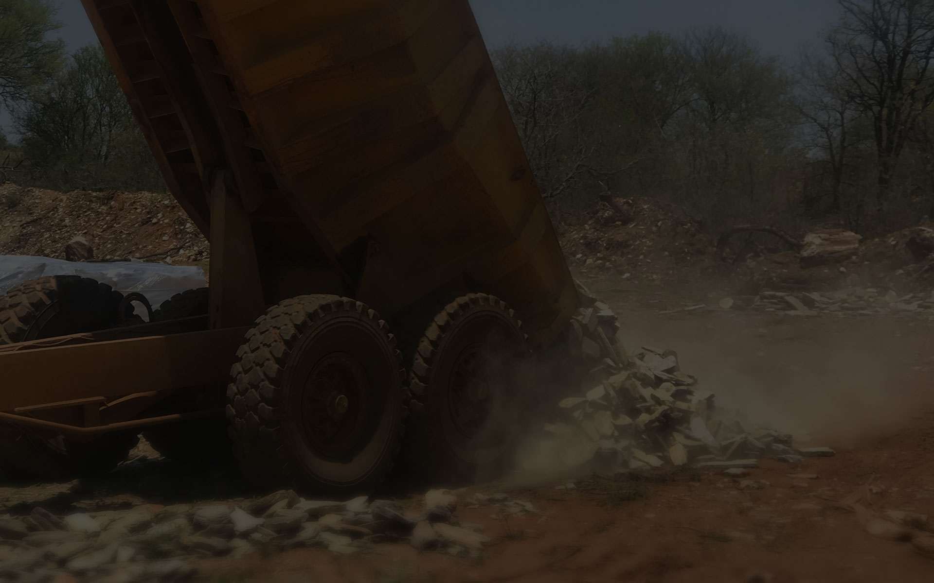 Tipper truck unloading split stone at the quarry
