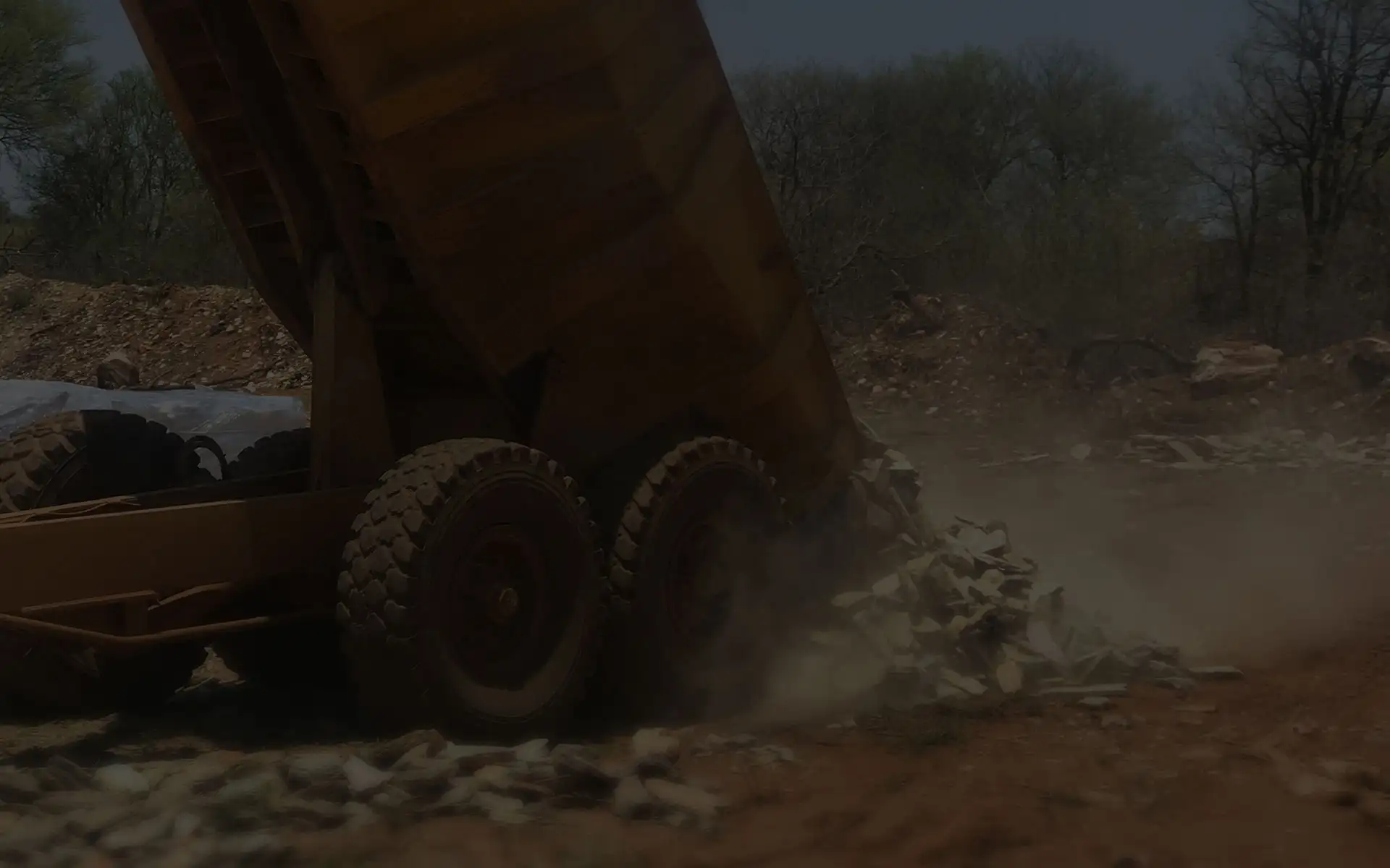 Tipper truck unloading split stone at the quarry